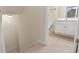 Hallway between rooms showing the stairs and access to a bathroom at 240 Huiet Dr, Mcdonough, GA 30252