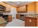 Updated kitchen featuring granite countertops, stainless steel appliances, and stylish backsplash at 240 Huiet Dr, Mcdonough, GA 30252