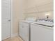 Laundry room with appliances, shelving, and easy access to the rest of the house at 240 Huiet Dr, Mcdonough, GA 30252