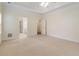 Spacious primary bedroom with neutral walls, carpet, ceiling fan and ensuite bathroom at 240 Huiet Dr, Mcdonough, GA 30252
