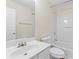 Clean bathroom with white fixtures and a large mirror at 274 Paden Cove Trl, Lawrenceville, GA 30044