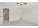 Spacious bedroom with neutral carpet and a ceiling fan at 274 Paden Cove Trl, Lawrenceville, GA 30044