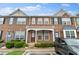 Charming brick townhome with well-maintained landscaping and covered entryway at 274 Paden Cove Trl, Lawrenceville, GA 30044