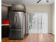Eat in kitchen with stainless steel refrigerator, hardwood floors, and sliding glass door at 274 Paden Cove Trl, Lawrenceville, GA 30044