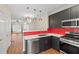 Open kitchen featuring modern cabinetry, stainless appliances and breakfast bar at 274 Paden Cove Trl, Lawrenceville, GA 30044