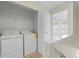 Upstairs laundry room with washer and dryer at 274 Paden Cove Trl, Lawrenceville, GA 30044