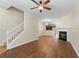 Open floor plan with hardwood floors, fireplace, stairs and view of the kitchen at 274 Paden Cove Trl, Lawrenceville, GA 30044