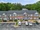 Charming brick townhomes with parking, surrounded by lush trees offering a blend of comfort and convenient city living at 274 Paden Cove Trl, Lawrenceville, GA 30044