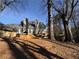 A spacious backyard with a wooden deck and mature trees offers a private outdoor retreat at 2887 Royal Blf, Decatur, GA 30030