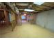 Unfinished basement space ready for customization with exposed beams and concrete walls at 2887 Royal Blf, Decatur, GA 30030