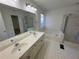 Bathroom featuring dual sinks, a soaking tub, and a glass-enclosed shower at 2887 Royal Blf, Decatur, GA 30030