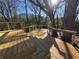 Wooden deck with cable railings showcasing private backyard with mature trees at 2887 Royal Blf, Decatur, GA 30030