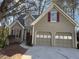 Traditional two-story home with attached two-car garage, well-manicured lawn and neutral siding at 2887 Royal Blf, Decatur, GA 30030