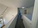 Carpeted hallway with neutrally painted walls leads to various rooms upstairs at 2887 Royal Blf, Decatur, GA 30030