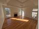 Bright living room with hardwood floors, a fireplace, and large windows offering natural light at 2887 Royal Blf, Decatur, GA 30030