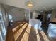 Open concept living space with hardwood floors, modern lighting, and seamless flow to the kitchen area at 2887 Royal Blf, Decatur, GA 30030