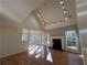 Spacious living room with fireplace, hardwood floors and natural light, enhanced by vaulted ceiling at 2887 Royal Blf, Decatur, GA 30030