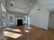 Bright living room features vaulted ceiling, fireplace, hardwood floors and natural light from many windows at 2887 Royal Blf, Decatur, GA 30030