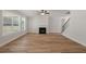 Open living room features a fireplace and staircase at 3264 Lions Ruby Ln, Atlanta, GA 30349