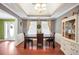 Elegant dining room with tray ceiling, decorative chandelier, and a large table perfect for gatherings at 950 Besse Way, Locust Grove, GA 30248