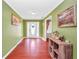Bright foyer with hardwood floors, light-colored walls, and decorative accents, creates a welcoming entrance at 950 Besse Way, Locust Grove, GA 30248