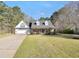 Charming single-story home with brick and siding exterior, well-manicured lawn, and attached garage at 950 Besse Way, Locust Grove, GA 30248