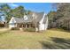 Charming single-story home with brick and siding exterior, well-manicured lawn, and attached garage at 950 Besse Way, Locust Grove, GA 30248