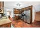 Well-lit kitchen with stainless steel appliances, ample cabinet space, and seamless layout at 950 Besse Way, Locust Grove, GA 30248