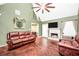 Open-concept living room with vaulted ceiling, fireplace, and comfortable seating, ideal for entertaining at 950 Besse Way, Locust Grove, GA 30248