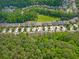 Overhead view showcasing this home's placement within a residential area near a green space at 1867 Willoughby Dr, Buford, GA 30519