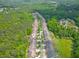 Scenic aerial view of a suburban community surrounded by dense green forests at 1867 Willoughby Dr, Buford, GA 30519