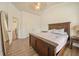Bedroom with vaulted ceiling, wood-look floors, and a large bed with nice finish at 1867 Willoughby Dr, Buford, GA 30519