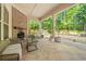 Covered patio with brick fireplace and outdoor seating area at 1867 Willoughby Dr, Buford, GA 30519