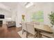 Cozy dining room with hardwood floors, ample natural light, and direct access to the backyard at 1867 Willoughby Dr, Buford, GA 30519