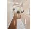 Inviting hallway features gleaming hardwood floors and decorative accents leading to the living area at 1867 Willoughby Dr, Buford, GA 30519