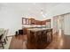 Beautiful kitchen with granite counters, wooden cabinets, hardwood floors, and a large center island at 1867 Willoughby Dr, Buford, GA 30519