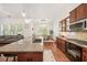 Open kitchen view showcasing granite countertops, stainless steel appliances, and barstool seating at the island at 1867 Willoughby Dr, Buford, GA 30519