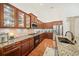 Charming kitchen featuring granite counters, tile backsplash, stainless steel appliances, and wood cabinets at 1867 Willoughby Dr, Buford, GA 30519