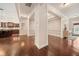Open-concept living room boasts elegant trim work and dark hardwood flooring, offering a modern look at 1867 Willoughby Dr, Buford, GA 30519