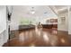 Inviting living room with a fireplace, hardwood floors and an open layout to the kitchen and dining area at 1867 Willoughby Dr, Buford, GA 30519