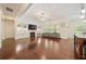 Bright living room featuring a fireplace, built-in shelves, and hardwood floors for modern comfort at 1867 Willoughby Dr, Buford, GA 30519