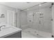 Luxurious bathroom featuring a glass enclosed shower with built-in bench and modern fixtures at 2122 Pembroke Dr, Brookhaven, GA 30319