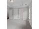 Neutral bedroom with carpet and adjacent rooms visible through open doorways at 2122 Pembroke Dr, Brookhaven, GA 30319