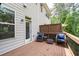 Exterior deck featuring patio furniture and a railing with forest views at 2122 Pembroke Dr, Brookhaven, GA 30319