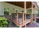 Wooden deck featuring wood railing and steps leading to a landscaped backyard at 2122 Pembroke Dr, Brookhaven, GA 30319