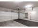 Clean, bright garage featuring a white garage door, and overhead lighting at 2122 Pembroke Dr, Brookhaven, GA 30319