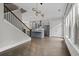 Open-concept layout with hardwood floors and a view of the modern kitchen at 2122 Pembroke Dr, Brookhaven, GA 30319