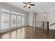 Bright living room featuring hardwood floors and French doors to a balcony, creating a relaxing and inviting atmosphere at 2122 Pembroke Dr, Brookhaven, GA 30319