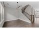 Large open living space with hardwood floors, modern lighting, and a staircase at 2122 Pembroke Dr, Brookhaven, GA 30319