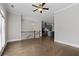 Open-concept living room with hardwood floors seamlessly transitions into a modern kitchen, creating a spacious and inviting atmosphere at 2122 Pembroke Dr, Brookhaven, GA 30319